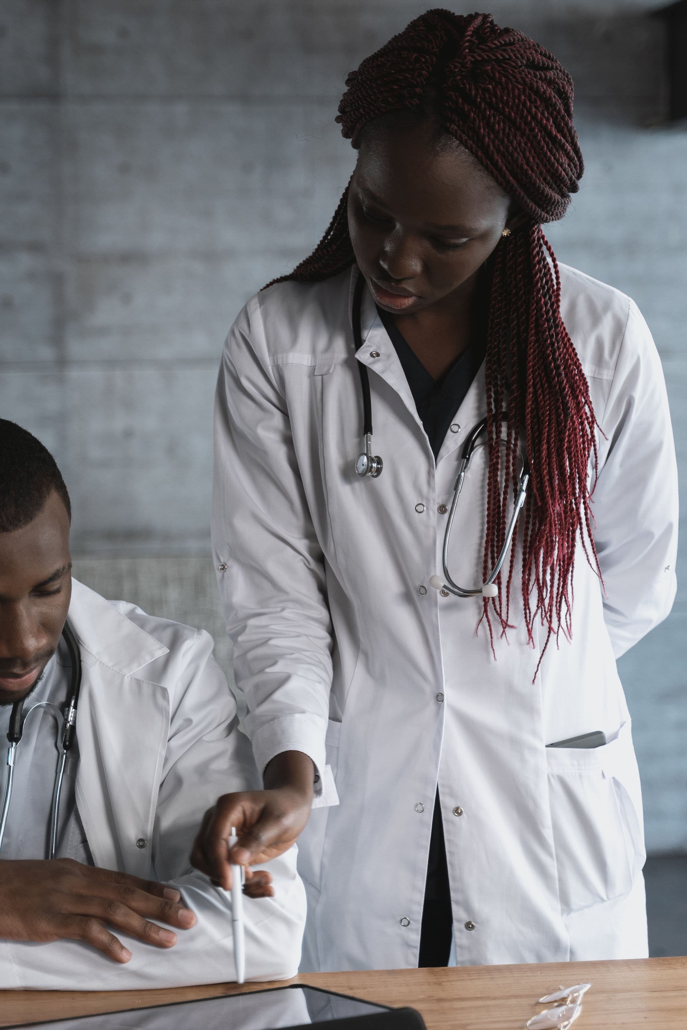 Two doctors reviewing a care plan together